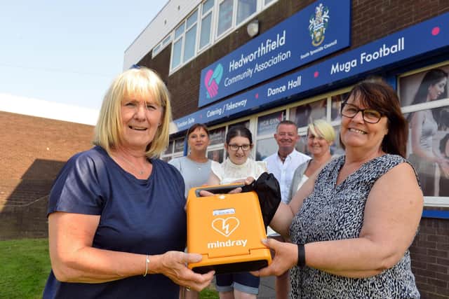 Jean Barclay, left and Christine Green show off the new defibrillator with other members of the team at Hedworthfield CA.