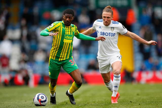 Ainsley Maitland-Niles of West Bromwich Albion battles for possession with Luke Ayling of Leeds United.