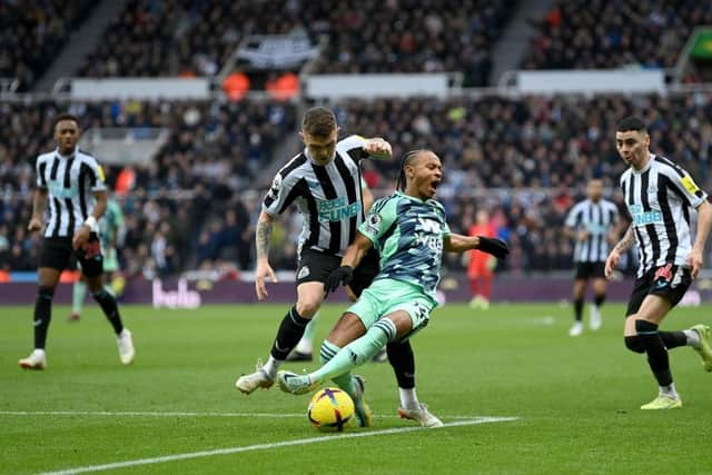 Kieran Trippier of Newcastle United fouls Bobby Reid of Fulham in the box which leads to a penalty for Fulham after a VAR check during the Premier League match between Newcastle United and Fulham FC at St. James Park on January 15, 2023 in Newcastle upon Tyne, England. (Photo by Michael Regan/Getty Images)