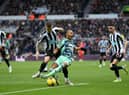 Kieran Trippier of Newcastle United fouls Bobby Reid of Fulham in the box which leads to a penalty for Fulham after a VAR check during the Premier League match between Newcastle United and Fulham FC at St. James Park on January 15, 2023 in Newcastle upon Tyne, England. (Photo by Michael Regan/Getty Images)