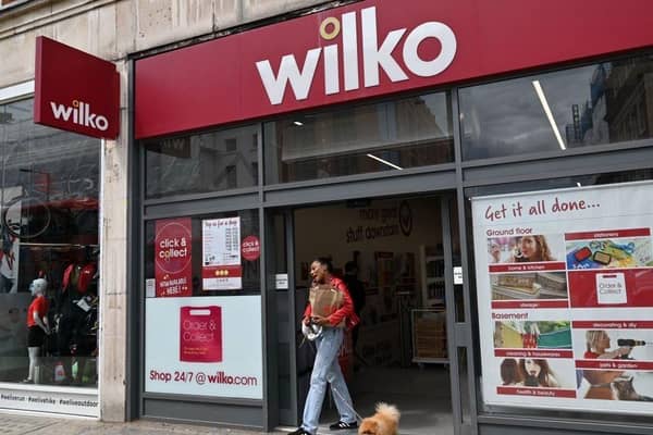 A shopper leaves a branch of Wilko, the high street retailer facing closure.