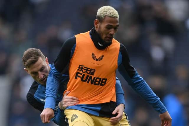 Joelinton warms up before the Tottenham Hotspur game.