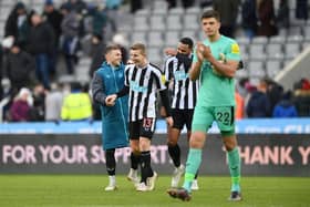 Kieran Trippier, Matt Targett and Jamaal Lascelles of Newcastle United share a joke after the friendly match between Newcastle United and Rayo Vallecano at St James' Park on December 17, 2022 in Newcastle upon Tyne, England. (Photo by Stu Forster/Getty Images)