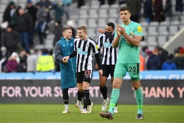 Kieran Trippier, Matt Targett and Jamaal Lascelles of Newcastle United share a joke after the friendly match between Newcastle United and Rayo Vallecano at St James' Park on December 17, 2022 in Newcastle upon Tyne, England. (Photo by Stu Forster/Getty Images)