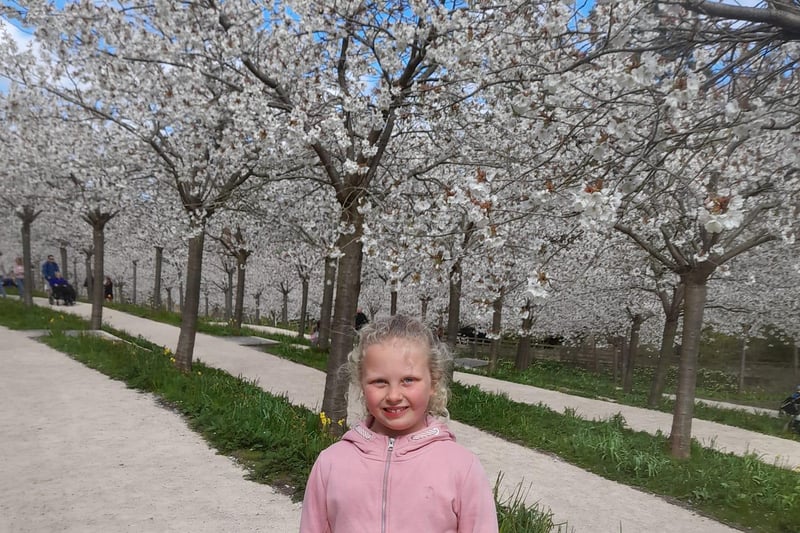Charlotte enjoying the cherry blossom at The Alnwick Garden.