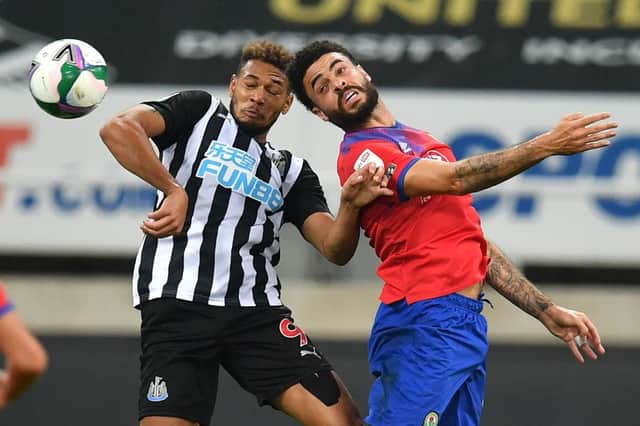 Newcastle United's Brazilian striker Joelinton (L) vies with Blackburn Rovers' Irish defender Derrick Williams (R) during the English League Cup second round football match between Newcastle United and Blackburn Rovers at St James' Park in Newcastle upon Tyne in north east England on September 15, 2020.