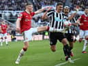 Manchester United's Scottish midfielder Scott McTominay (L) vies with Newcastle United's Dutch defender Sven Botman (C) during the English Premier League football match between Newcastle United and Manchester United at St James' Park in Newcastle-upon-Tyne, north east England on April 2, 2023. (Photo by Oli SCARFF / AFP)