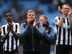 Newcastle United head coach Eddie Howe with Alexander Isak and Dan Burn after the final whistle at the Etihad Stadium.