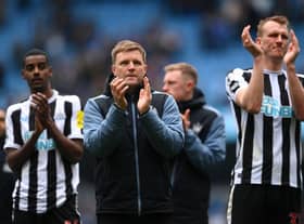 Newcastle United head coach Eddie Howe with Alexander Isak and Dan Burn after the final whistle at the Etihad Stadium.