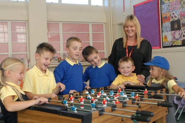 It's the Lord Blyton After School Club in 2013, with head teacher Jo Atherton joining the pupils for a game.