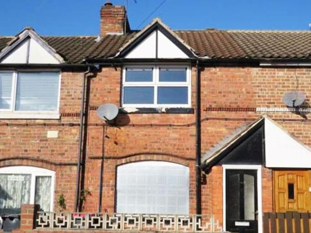 Three-bedroom, mid-terrace house - guide price £10,000-plus.