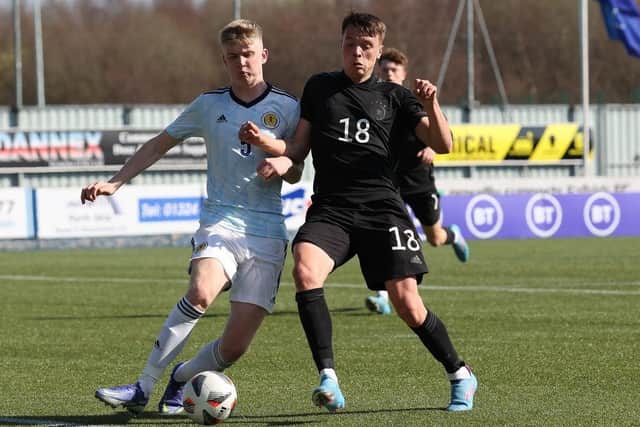 Charlie McArthur of Scotland vies with Dzenan Pecinovic of Germany during the UEFA Under17 European Championship Qualifier match between Germany U17 and Scotland U17 on March 26, 2022 in Glasgow, Scotland. (Photo by Ian MacNicol/Getty Images)