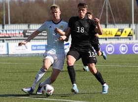 Charlie McArthur of Scotland vies with Dzenan Pecinovic of Germany during the UEFA Under17 European Championship Qualifier match between Germany U17 and Scotland U17 on March 26, 2022 in Glasgow, Scotland. (Photo by Ian MacNicol/Getty Images)