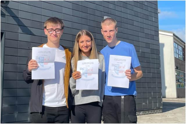 Louis Summerly celebrates his top results with fellow St Joseph's Catholic Academy A Level students, Josh Mitchell and Megan Shiell.
