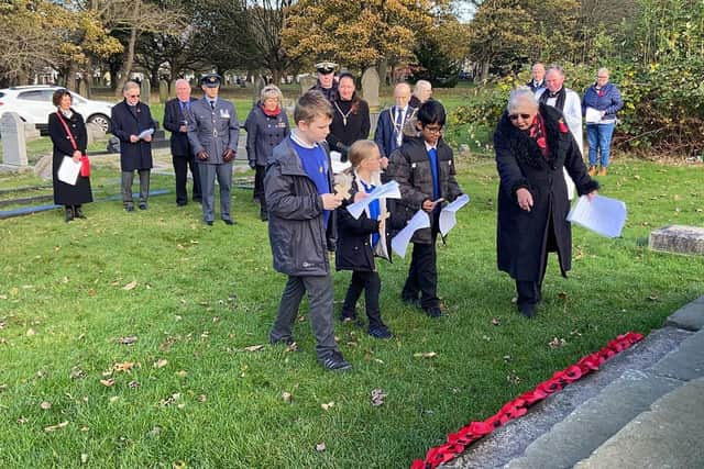 Pupils from Marine Park Primary School laid crosses during the ceremony.