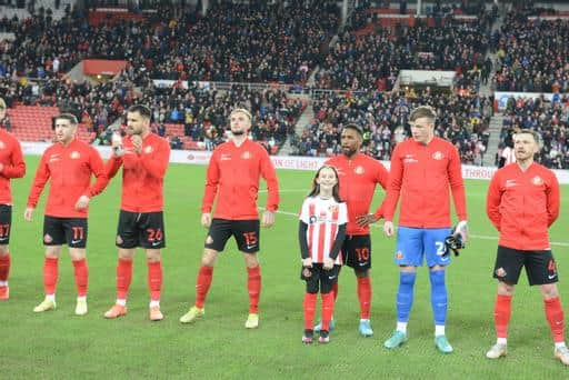 Echo mascot winner Eliza Atkinson with her hero Jermain Defoe