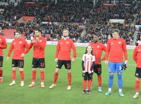 Echo mascot winner Eliza Atkinson with her hero Jermain Defoe