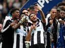 NEWCASTLE UPON TYNE, ENGLAND - MAY 07:  Newcastle United players Vurnon Anita (r) and Achraf Lazaar (c) celebrate by taking selfie photographs after winning the Sky Bet Championship match between Newcastle United and Barnsley at St James' Park on May 7, 2017 in Newcastle upon Tyne, England.  (Photo by Stu Forster/Getty Images)