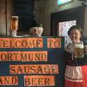 Prost! Dressed for the occasion at the Albion from left, Fräulein Susan McElwee, Herr Jess McConnell and Fräulein Amy Giles.