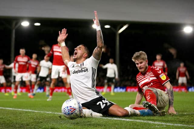 LONDON, ENGLAND - JANUARY 17: Anthony Knockaert of Fulham is fouled by Hayden Coulson of Middlesbrough FC during the Sky Bet Championship match between Fulham and Middlesbrough at Craven Cottage on January 17, 2020 in London, England. (Photo by James Chance/Getty Images)