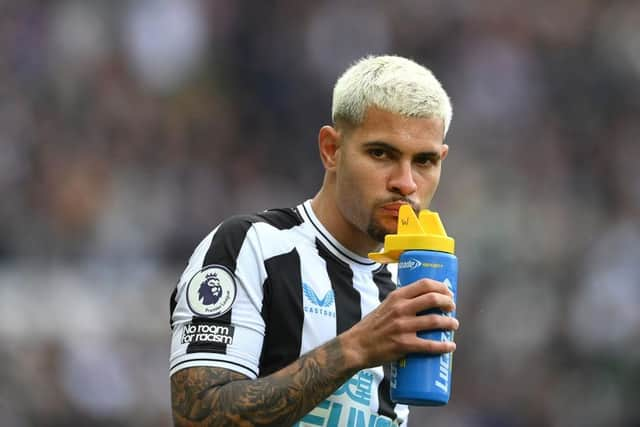 Newcastle player Bruno Guimaraes takes a drink from a lucozade bottle prior to the Premier League match between Newcastle United and Tottenham Hotspur at St. James Park on April 23, 2023 in Newcastle upon Tyne, England. (Photo by Stu Forster/Getty Images)