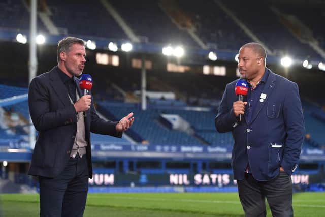 Jamie Carragher speaks with John Barnes for Sky Sports after the Premier League match between Everton FC and Liverpool FC at Goodison Park on June 21, 2020 in Liverpool, England. Football Stadiums around Europe remain empty due to the Coronavirus Pandemic as Government social distancing laws prohibit fans inside venues resulting in all fixtures being played behind closed doors.