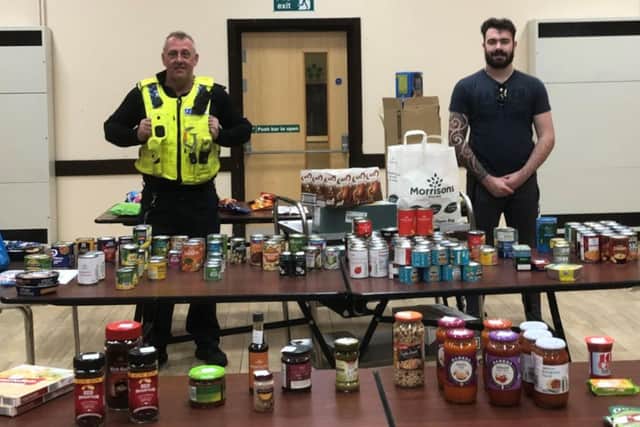 PC Jason Sweeney and former Paralympic swimming champion Josef Craig who is volunteering to deliver goods to those who need them most across Jarrow.