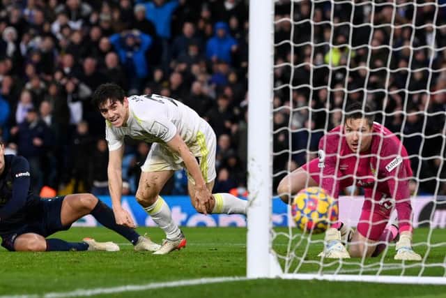 Daniel James of Leeds United scores their sides third goal past Wayne Hennessey of Burnley  during the Premier League match between Leeds United and Burnley at Elland Road on January 02, 2022 in Leeds, England. (Photo by Stu Forster/Getty Images)