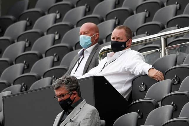 Newcastle United's English owner Mike Ashley (R) watches the English Premier League football match between Newcastle United and Brighton and Hove Albion at St James' Park in Newcastle upon Tyne, north-east England on September 20, 2020.