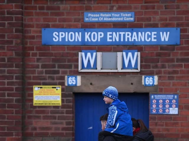 A young fan arrives on the shoulders of his father prior to the Emirates FA Cup Third Round match between Sheffield Wednesday and Newcastle United at Hillsborough on January 07, 2023 in Sheffield, England. (Photo by Laurence Griffiths/Getty Images)