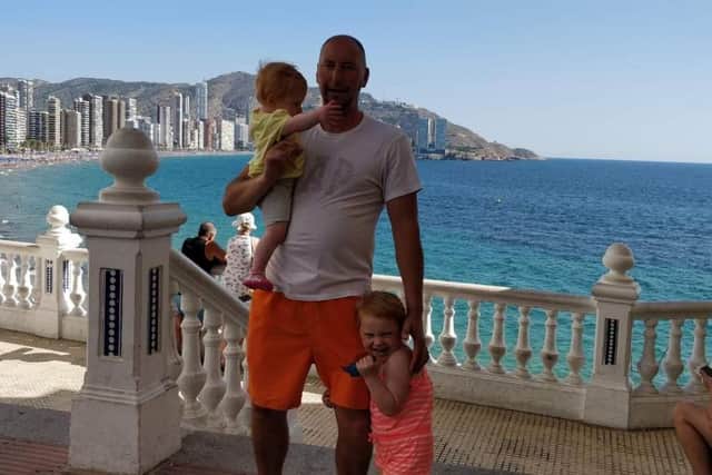 Lee Foster, 44, from Hebburn, pictured with his daughters.