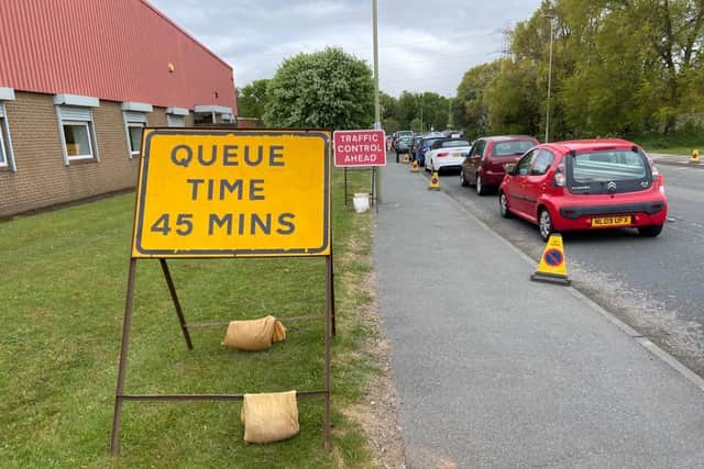 Signs have been put up on Middlefields Industrial Estate letting people know how long they can expect to wait to get into the Recycling Village.