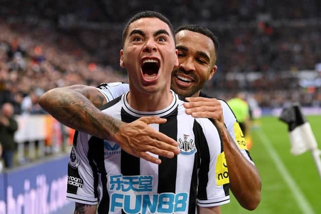 Miguel Almiron of Newcastle United celebrates after scoring their side's fourth goal with Callum Wilson during the Premier League match between Newcastle United and Aston Villa at St. James Park on October 29, 2022 in Newcastle upon Tyne, England. (Photo by Stu Forster/Getty Images)