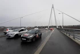 Driving instructors cross the Northern Spire Bridge as part of a protest convoy against the planned closure of South Tyneside's driving test centre 28/02/22