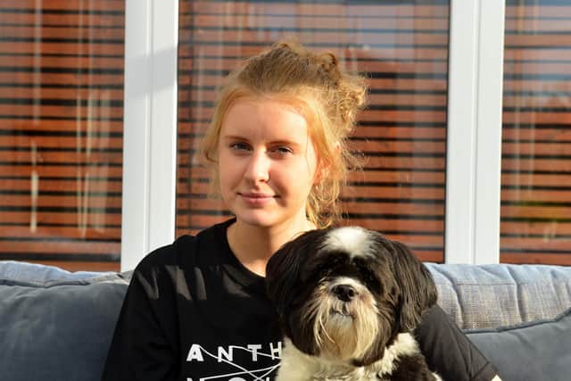 Abbie, 18, with her dog Max.