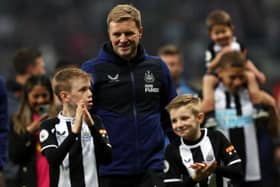 Eddie Howe on the pitch with his children after Newcastle United's win over Arsenal in May.