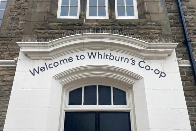 The new sign put up above the door on the front street of Whitburn, as the Co-op moves in to the old Grey Horse pub.
