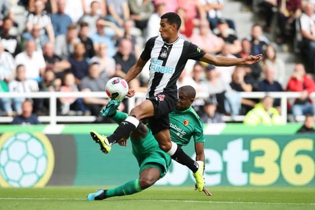 Newcastle United's Isaac Hayden clashes with Watford's Christian Kabasele (Photo by Ian MacNicol/Getty Images)