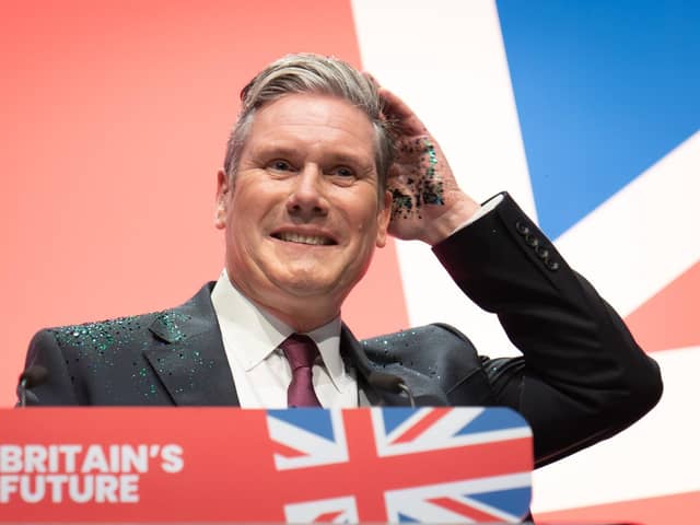 Labour leader, Sir Keir Starmer delivers his keynote speech to the Labour Party Conference in Liverpool with his hands covered in glitter after a protester ran onto the stage. Picture date: Tuesday October 10, 2023. PA Photo. See PA story POLITICS Labour. Photo credit should read: Stefan Rousseau/PA Wire 