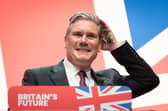 Labour leader, Sir Keir Starmer delivers his keynote speech to the Labour Party Conference in Liverpool with his hands covered in glitter after a protester ran onto the stage. Picture date: Tuesday October 10, 2023. PA Photo. See PA story POLITICS Labour. Photo credit should read: Stefan Rousseau/PA Wire 