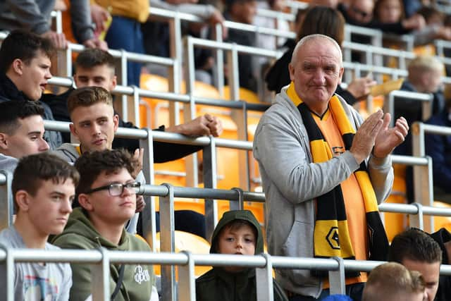 Fans wait in seats with built-in safety barriers, known as rail seating, to allow safe standing, ahead of the English Premier League football match between Wolverhampton Wanderers and Manchester United at the Molineux stadium in Wolverhampton, central England on August 19, 2019. ( PAUL ELLIS/AFP via Getty Images)