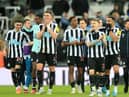 Match-winner Miguel Almiron, far left, celebrates with his Newcastle United team-mates.