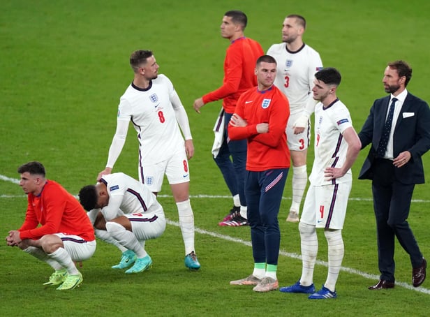 England manager Gareth Southgate (right) is dejected with is players following the penalty shoot out during the UEFA Euro 2020 Final at Wembley Stadium, London. Picture date: Sunday July 11, 2021.