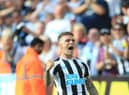 Newcastle United's English defender Kieran Trippier celebrates after scoring his team third goal during the English Premier League football match between Newcastle United and Manchester City at St James' Park in Newcastle-upon-Tyne, north east England, on August 21, 2022. (Photo by LINDSEY PARNABY/AFP via Getty Images)