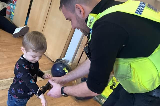 PCSO Steve Graham with a Nurserytime youngster.