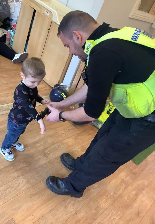PCSO Steve Graham with a Nurserytime youngster.