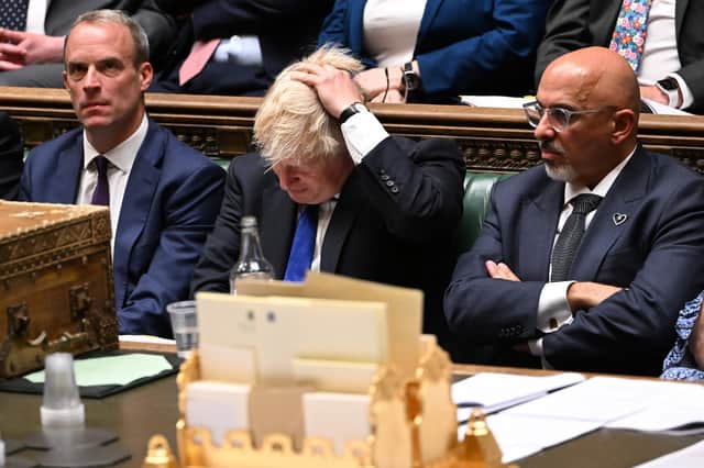Boris Johnson flanked by Justice Secretary and deputy Prime Minister Dominic Raab, left, and new Chancellor of the Exchequer Nadhim Zahawi during prime minister's questions in the House of Commons on July 6. Photo by Jessica Taylor / UK Parliament / AFP via Getty Images
