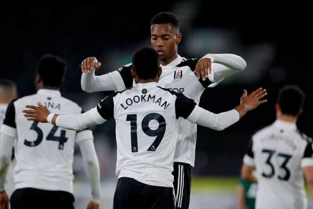 Ademola Lookman of Fulham celebrates with team mate Tosin Adarabioyo after scoring their side's first goal against Sheffield United.