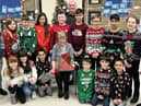Retiring caretaker Joan Mulley, 80, surrounded by children from Hadrian Primary School.