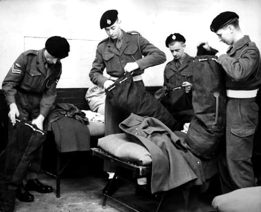 'I'm sure my mobile phone is in here somewhere...'FILE photo dated 24/10/52 of national service men of the 1st Royal Tank Regiment packing their kit at Fowler Barracks, Tidworth, in readiness for their departure for Korea. Teenagers would not be sent to jail for defying the Tories' proposed "mandatory" national service, James Cleverly has said, as Labour branded the policy a "gimmick". Photo credit: PA/PA Wire
